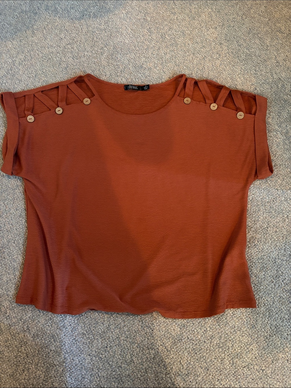 Cutout Shoulder Knit Top in Rust by Cure